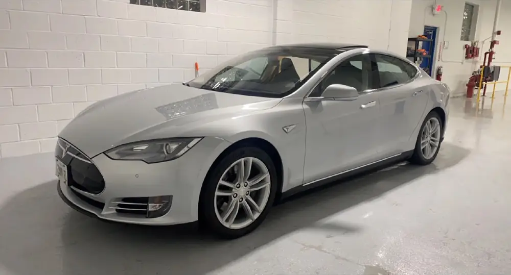 Silver Tesla Model S in the shop after a detail